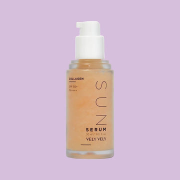 Assemble K - Play .Try .Glow holds a bottle of VELYVELY Collagen Sun Serum, a lightweight, hydrating SPF 50+ PA++++ sunscreen with a pinkish tint.