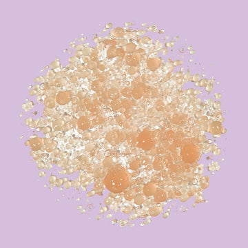 Assemble K - Play .Try .Glow holds a bottle of VELYVELY Collagen Sun Serum, a lightweight, hydrating SPF 50+ PA++++ sunscreen with a pinkish tint.