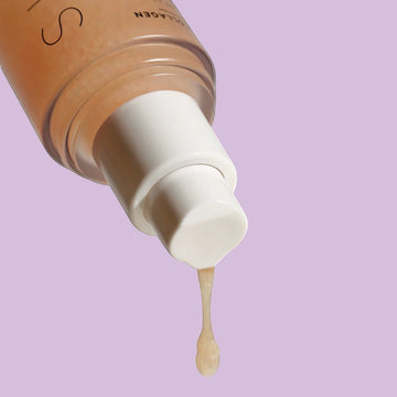 Assemble K - Play .Try .Glow holds a bottle of VELYVELY Collagen Sun Serum, a lightweight, hydrating SPF 50+ PA++++ sunscreen with a pinkish tint.