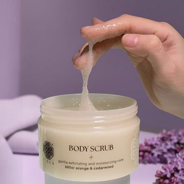 Assemble K - Play .Try .Glow Tiela Perfume Therapy Body Scrub Shine 250g, a creamy, exfoliating sugar scrub with a citrus-floral-woody scent.