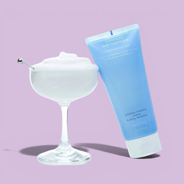 Assemble K - Play .Try .Glow NOT4U Clear Acfit Body Pack Scrub 220g, a light blue tube dispensing white scrub onto a hand.