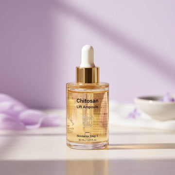Assemble K - Play .Try .Glow Skinterior Step 3 Chitosan Lift Ampoule, a clear serum with gold flecks in a glass dropper bottle.