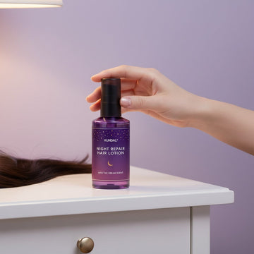 Assemble K - Play .Try .Glow Kundal Night Repair Hair Lotion in Into The Dream Scent, 100ml bottle with purple starry design.