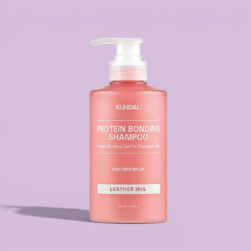 Assemble K - Play .Try .Glow KUNDAL Protein Damage Care Shampoo 500ml in Violet Muguet or Leather Iris scent, creamy pearl texture.