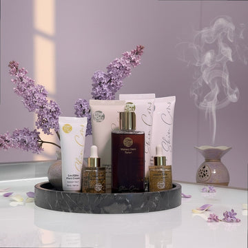 Assemble K - Play .Try .Glow Step 4 Lecithin Plant Cream, a white tube with gold accents, part of a skincare set.