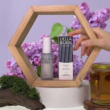 Assemble K Della Born Manuka Honey Serum 30ml bottle and box with honey jar and moss decor.