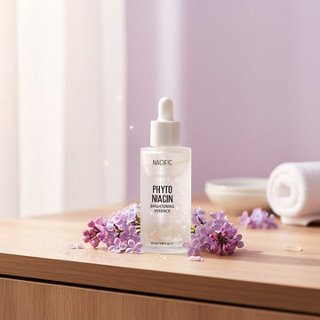 Assemble K - Play .Try .Glow NACIFIC Phyto Niacin Brightening Essence serum in a clear glass bottle with white dropper.