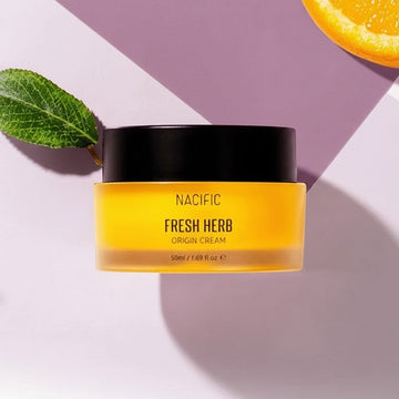 Assemble K - Play .Try .Glow NACIFIC Fresh Herb Origin Cream, a moisturizing skincare product in a frosted glass jar with a black lid.