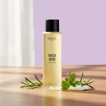 Assemble K - Play .Try .Glow NACIFIC Fresh Herb Origin Toner, a clear yellow liquid in a glass bottle with a black cap, 150ml.
