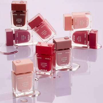 Assemble K - Play .Try .Glow Inga Water Double Lasting Scented Tint in Nudey Rosy and other shades. Clear bottles with colored liquid and square caps.