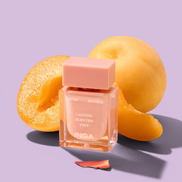 Assemble K - Play .Try .Glow Inga Water Double Lasting Scented Tint in Nudey Rosy, a sheer rosy-pink lip tint with a glossy finish, shown with its packaging.