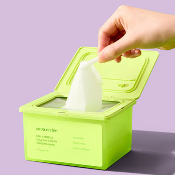 Assemble K - Play .Try .Glow Papa Recipe Real Centella Cica Daily Quick Cooling Mask packaging with tongs and centella leaves.