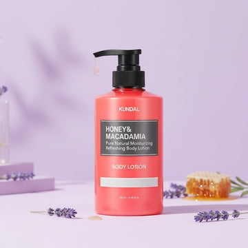 Assemble K - Play .Try .Glow Honey & Macadamia body lotion in a coral bottle with lavender and honeycomb accents.