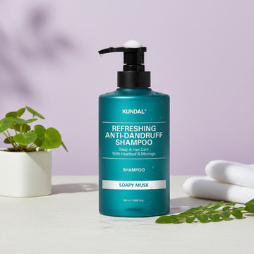 Assemble K - Play .Try .Glow teal bottle of Kundal Refreshing Anti-Dandruff Shampoo with Soapy Musk scent, 500ml.