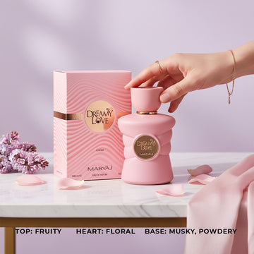 Assemble K - Play .Try .Glow Maryaj Tender Love perfume bottle and box in soft pink on a marble table with flower petals