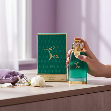 Assemble K - Play .Try .Glow Maryaj Tina floral eau de parfum bottle and box on a table with a white rose and pearls.