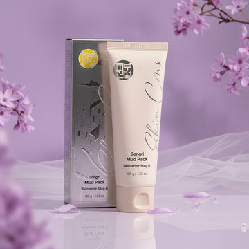 Assemble K - Play .Try .Glow Skinterior Gongri Mud Pack, a pale pink tube with a beige cap, and its silver packaging.