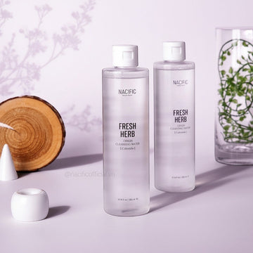 Assemble K - Play .Try .Glow NACIFIC Fresh Herb Origin Cleansing Water bottles on a minimalist table with decor.