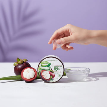 Assemble K - Play .Try .Glow NATURE REPUBLIC mangosteen and aloe soothing gel jar with fresh fruit on a purple background
