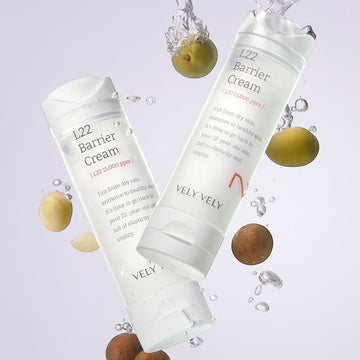 Assemble K - Play .Try .Glow VELY VELY L22 Barrier Cream 50ml, a white tube with L22 Barrier Cream text, surrounded by water splashes and nuts.