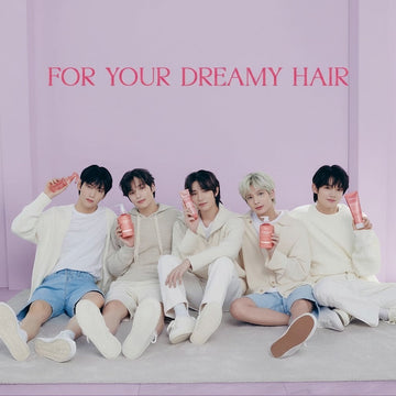 Assemble K - Play .Try .Glow models holding KUNDAL Protein Bonding Damage Care No Wash Treatment 130 ml in Violet Muguet and Leather Iris scents.