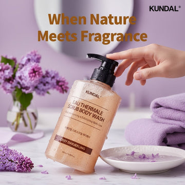 Assemble K - Play .Try .Glow Eau Thermale Spa Scrub Body Wash in Cozy Darling scent, a peach-toned exfoliating body wash with a pump dispenser.