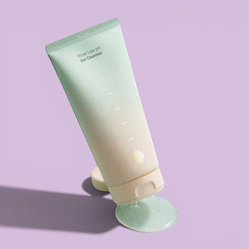 Assemble K - Play .Try .Glow Tiela Ritual Low pH Gel Cleanser tube and box with a drop of cleanser falling from a finger.