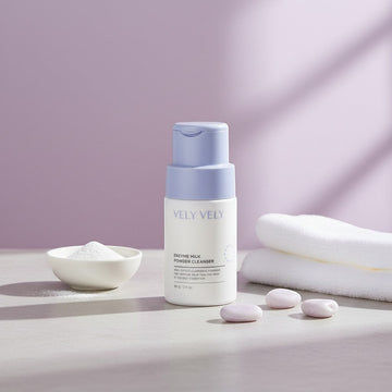 Assemble K - Play .Try .Glow VELY VELY Enzyme Milk Powder Cleanser in a white bottle with a light purple cap, 60g.