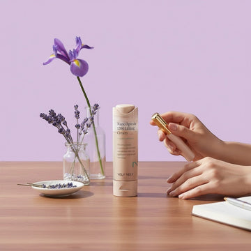 Assemble K - Play .Try .Glow VELY VELY Nano Spicule 1200 Lifting Cream tube with a gold applicator, lavender sprigs, and a notebook.