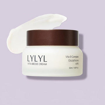 Assemble K - Play .Try .Glow LYLYL Vita ABCDE Cream jar with a swirl of white cream, featuring Vita 9 Complex, Glutathione, and HPR.