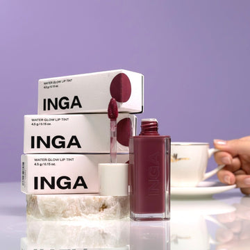 Assemble K - Play .Try .Glow INGA Water Glow Lip Tint in a deep berry shade, with applicator wand and packaging.