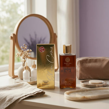 Assemble K - Play .Try .Glow Skinterior Step 2 Watery Dam Toner in amber glass bottle with gold cap. Hydrating toner for clearer skin.