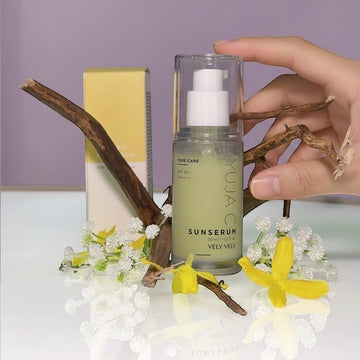 Assemble K - Play .Try .Glow VELY VELY Yuja C Sun Serum 30ml with SPF 50+ PA++++, a light green serum in a clear pump bottle, with yellow box packaging.