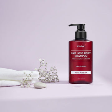 KUNDAL Hair Loss Relief Shampoo in Baby Powder scent, 500ml bottle with pump dispenser. Intensive scalp care with caffeine.
