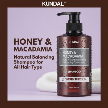 KUNDAL Honey & Macadamia Natural Balancing Shampoo for All Hair Types, Cherry Blossom scent, 500ml bottle.